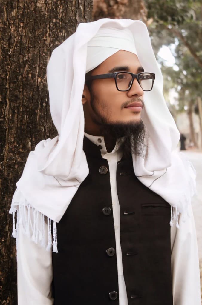 Portrait of Hafez Mawlana Hafijur Rahman, instructor at Al-Qur'anic Academy, wearing traditional Islamic attire